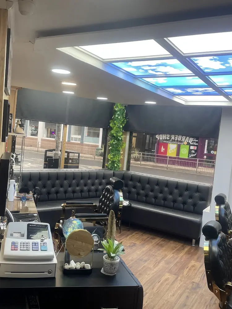 Chesterfield banquette by the window inside Mercia Barbers
